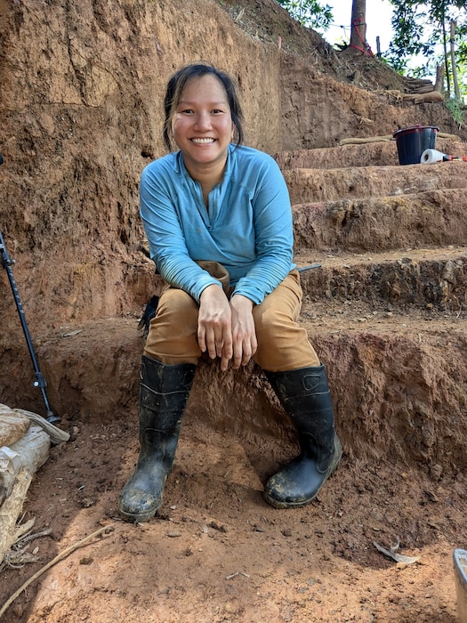 U.S. Air Force Maj. Anh Ison, 28th Medical Group pharmacy element chief, smiles during her volunteer shift in A Luoi, Vietnam, Aug. 5, 2024. Ison worked with the Defense POW/MIA Accounting Agency for nine weeks on a mission that had volunteers searching for the remains of people who went missing during the Vietnam War. (U.S. Air Force Courtesy Photo)