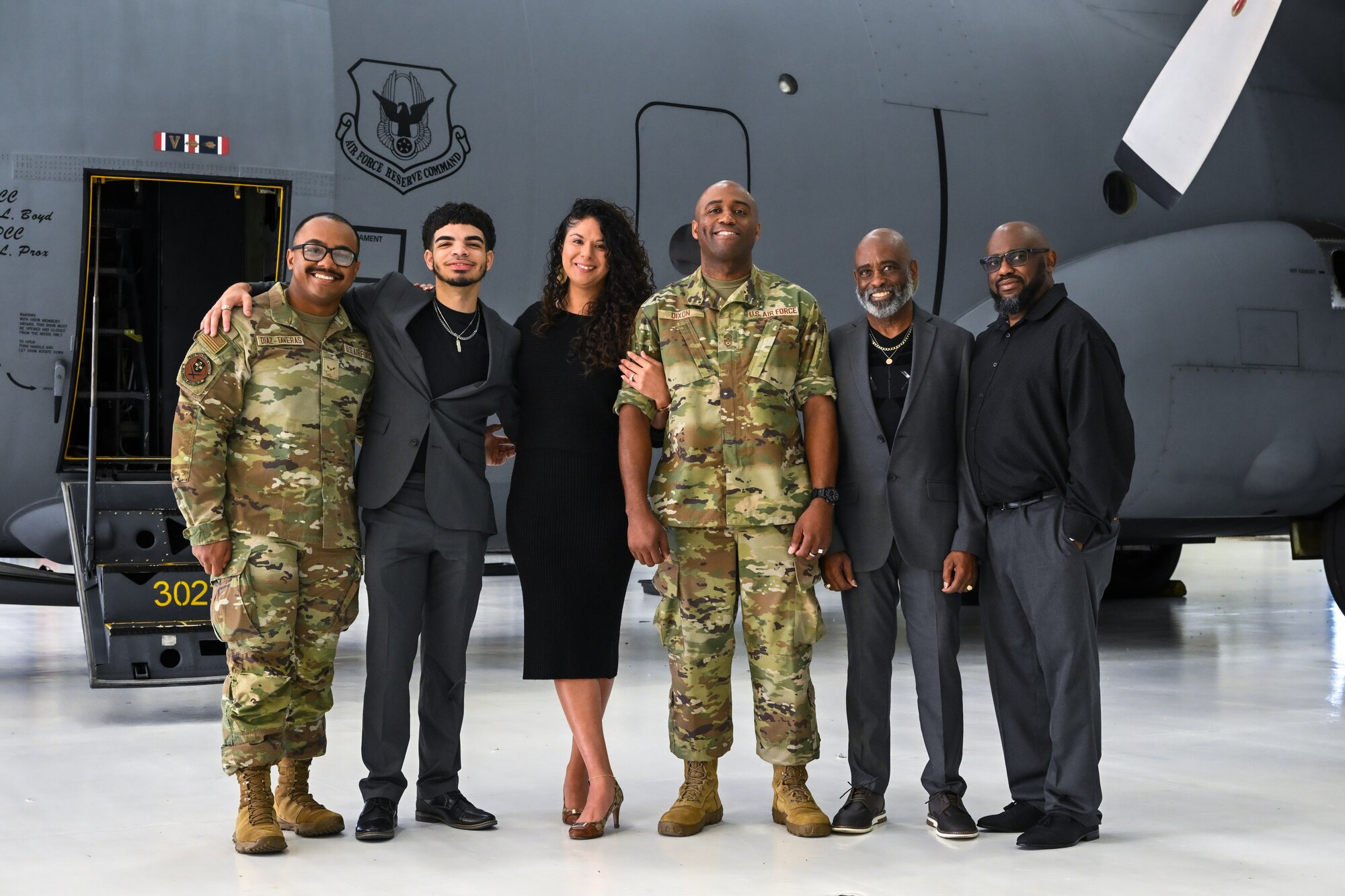 Chief Master Sgt. Howard Dixon, 910th Airlift Wing command chief, poses for a photo with his family after officially assuming responsibility as command chief during a ceremony at Youngstown Air Reserve Station, Ohio, Oct. 5, 2024.