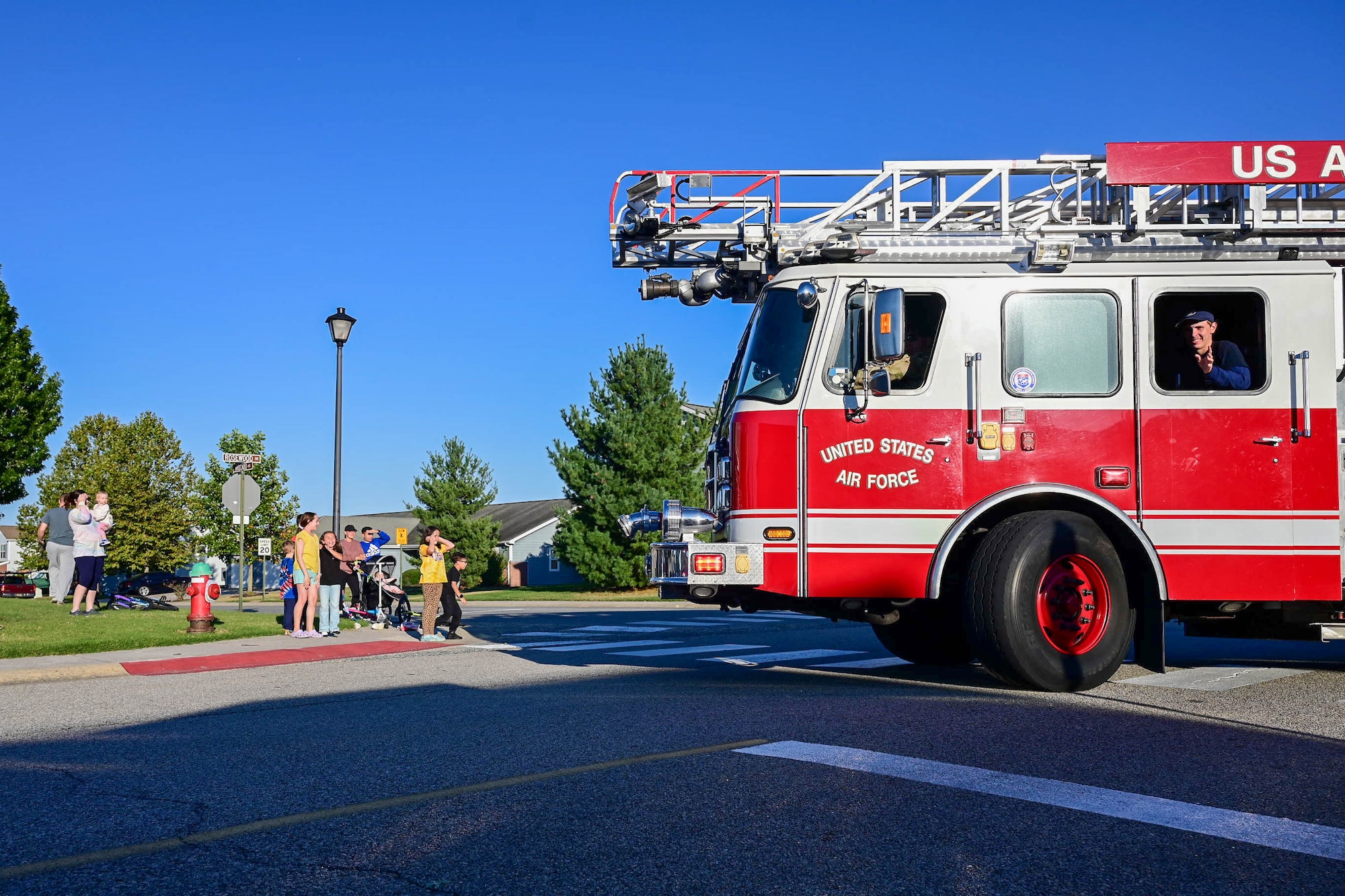 Firetrucks and first responder vehicles belonging to the 436th Civil Engineer Squadron move through base housing during the 2024 Fire Prevention Week Parade at Dover Air Force Base, Delaware, Oct. 11, 2024. First observed in 1925, Fire Prevention Week is the longest running public health observance in the United States. (U.S. Air Force photo by Mauricio Campino)