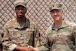 Private 1st Class Iniolowa Oluowotade, left, of Carnage Company 1-112th Infantry, 56th Stryker Brigade Combat Team was promoted to Specialist at Camp Lemonnier, Djibouti, September 27, 2024. (U.S. Army National Guard photo by Capt. Owen Dietrich)