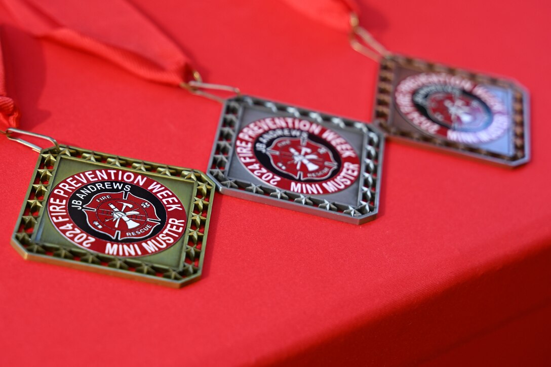 Awards are displayed during the Mini Muster fire safety event at Joint Base Andrews, Md., Oct. 10, 2024. Part of Fire Prevention Week, the event highlighted the importance of awareness, education, and community involvement in reducing fire risks. (U.S. Air Force photo by Airman 1st Class Gianluca Ciccopiedi)