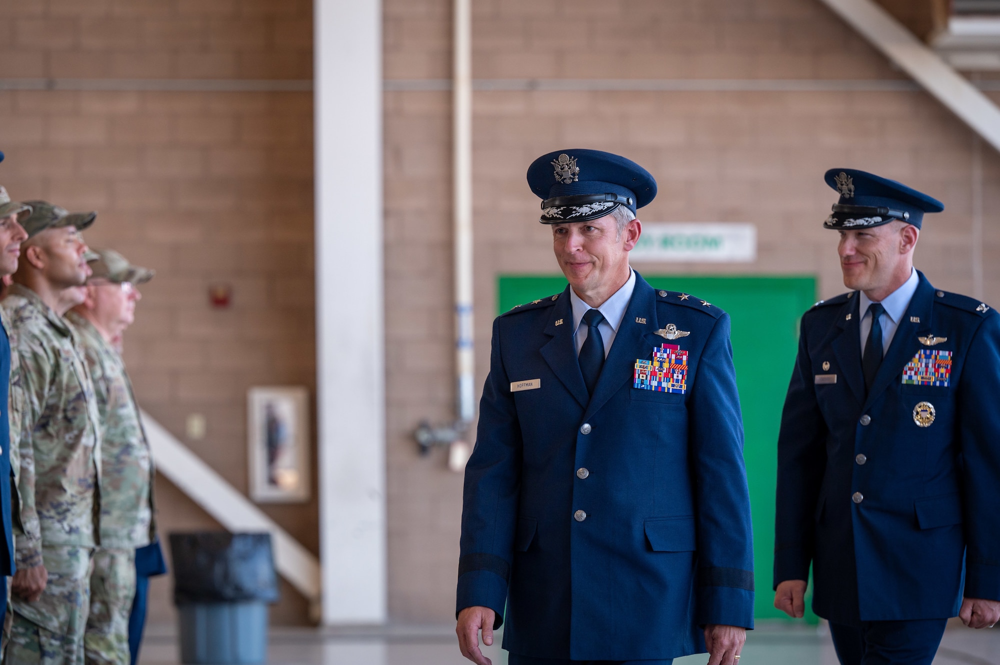 Men in military dress uniforms walk