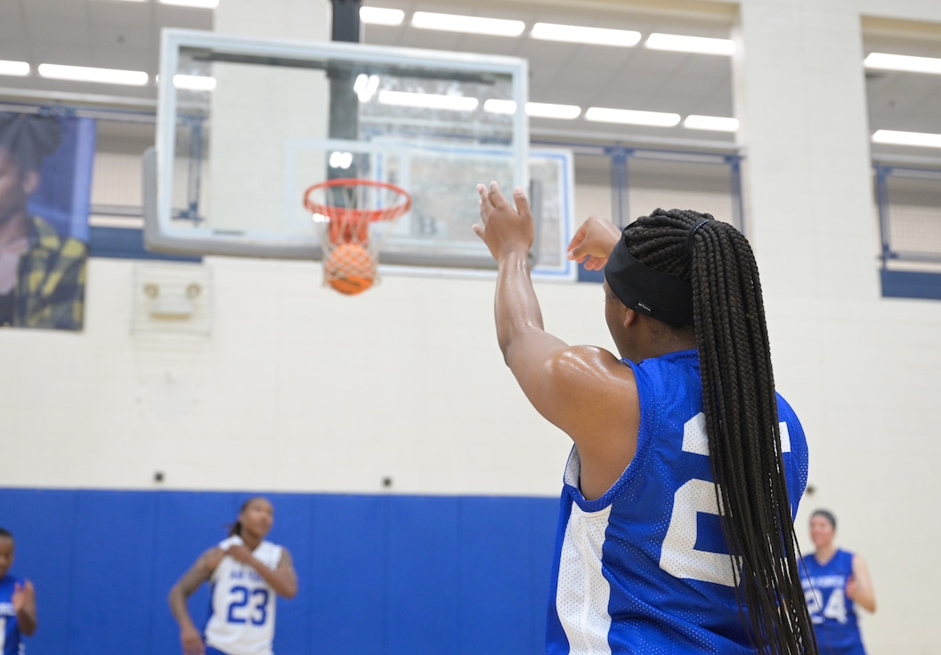 U.S. Air Force Senior Airman Whitney Williams, 4th Reconnaissance Squadron maintenance management, successfully shoots the basketball from the free-throw line at Joint Base Langley-Eustis, Virginia, Sept. 27, 2024. The new team had training three times a day, while also competing against other teams during the two-week trial at JBLE. (U.S. Air Force photo by Airman 1st Class Adisen Smith)