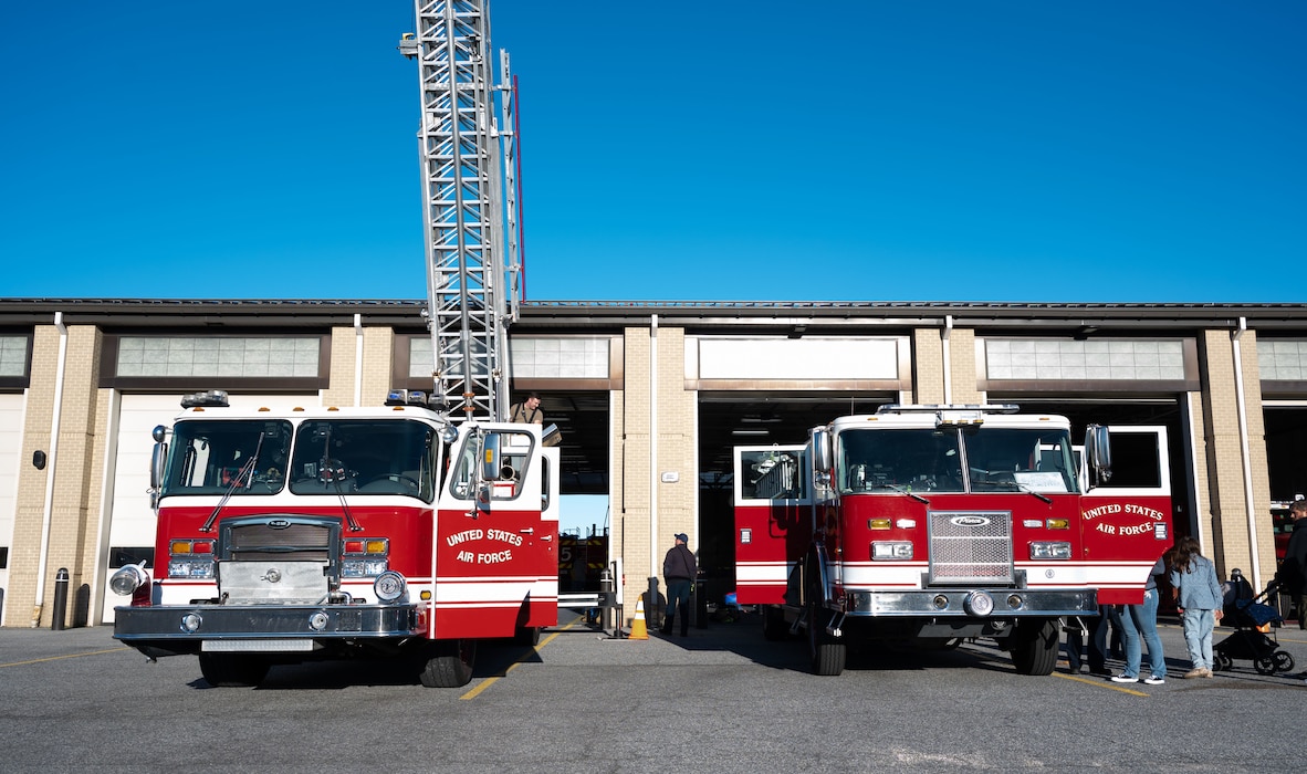 Fire trucks assigned to the 436th Civil Engineer Squadron Fire Department, sit in front of the Firehouse during an open house at Dover Air Force Base, Delaware, Oct. 10, 2024. The open house took place during Fire Prevention Week, a nationally observed week used to educate people on fire prevention. (U.S. Air Force Photo by Dieondiere Jefferies)