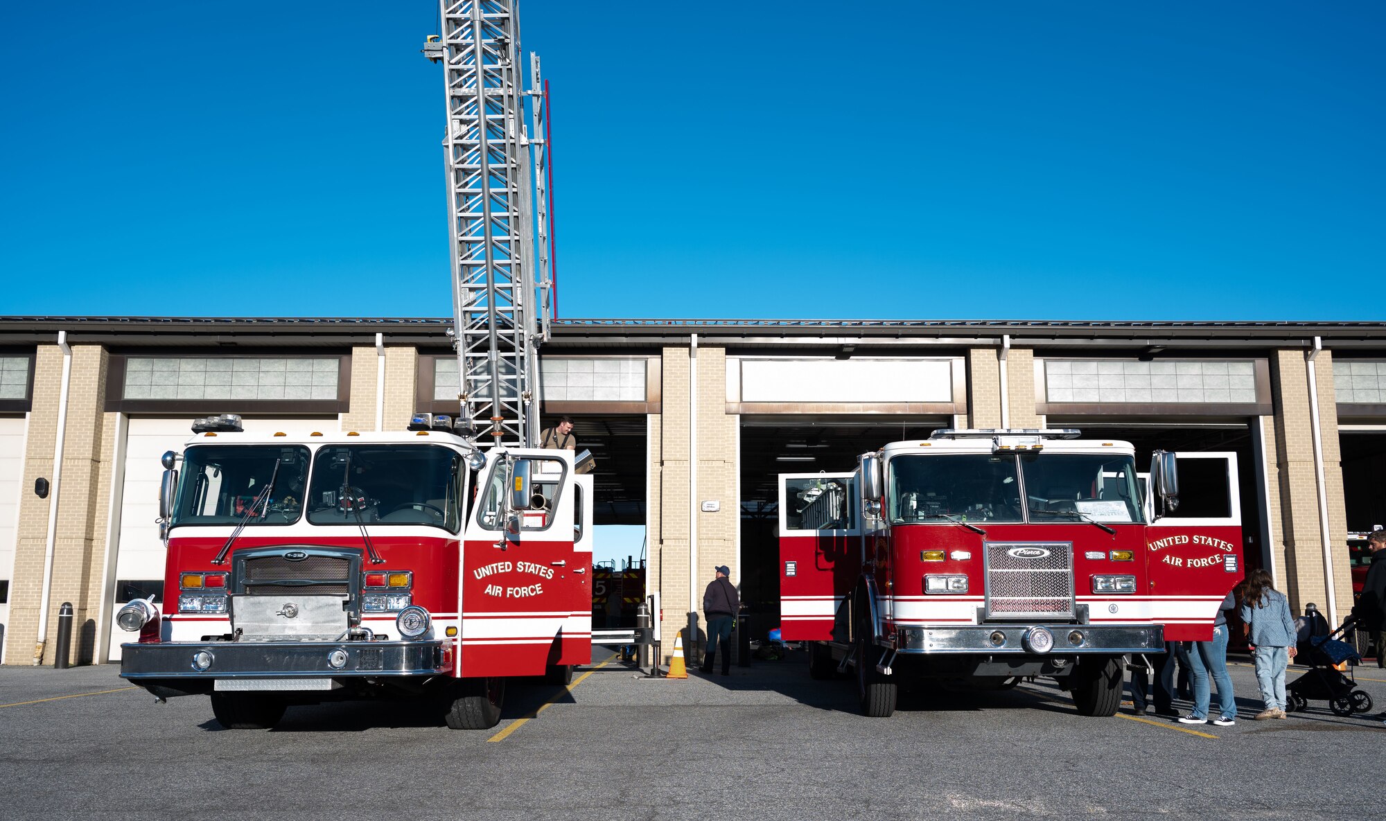Fire trucks assigned to the 436th Civil Engineer Squadron Fire Department, sit in front of the Firehouse during an open house at Dover Air Force Base, Delaware, Oct. 10, 2024. The open house took place during Fire Prevention Week, a nationally observed week used to educate people on fire prevention. (U.S. Air Force Photo by Dieondiere Jefferies)