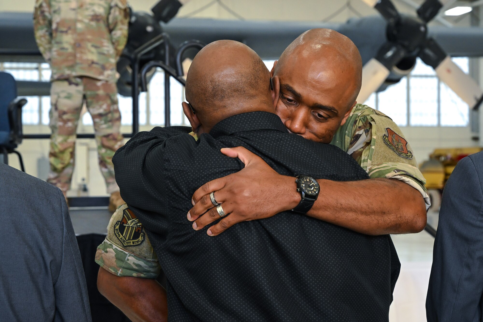 Chief Master Sgt. Howard Dixon, 910th Airlift Wing command chief, embraces his brother after officially assuming responsibility as command chief during a ceremony at Youngstown Air Reserve Station, Ohio, Oct. 5, 2024.