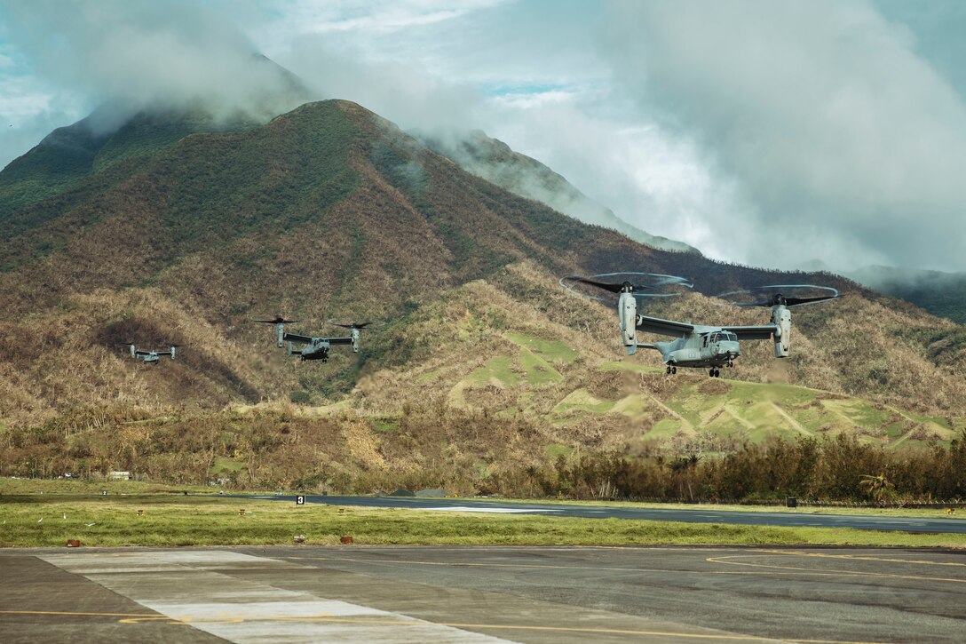U.S. Marine Corps MV-22B Ospreys attached to Marine Medium Tiltrotor Squadron (VMM) 165 (Reinforced), 15th Marine Expeditionary Unit, land at Basco Airport during foreign disaster relief operations in Basco, Batanes Province, Philippines, Oct. 8, 2024. The U.S. Department of Defense is supporting the Republic of the Philippines at the request of the Government of the Philippines providing foreign disaster relief in the aftermath of Typhoon Krathon (Julian) in Northern Luzon. (U.S. Marine Corps photo by Cpl. Joseph Helms)