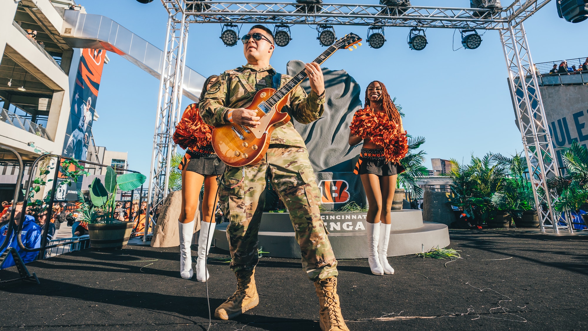 Chris Arellano playing his guitar for the Bengals NFL team.