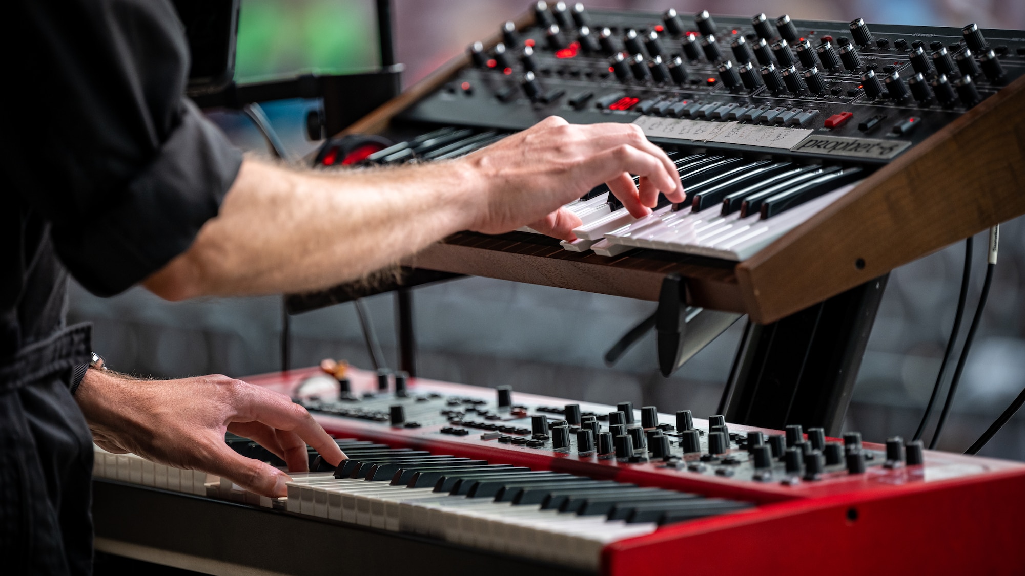 Shawn Hanlon playing the keyboards at a Flight One concert.