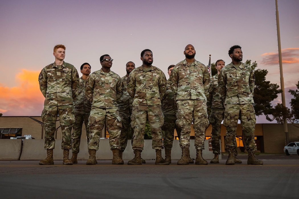 U.S. Air Force Airmen assigned to the 56th Fighter Wing stand at parade rest in preparation to aid in the arrival of Singapore Armed Forces Vice Adm. Aaron Beng, Chief of Defense Force.