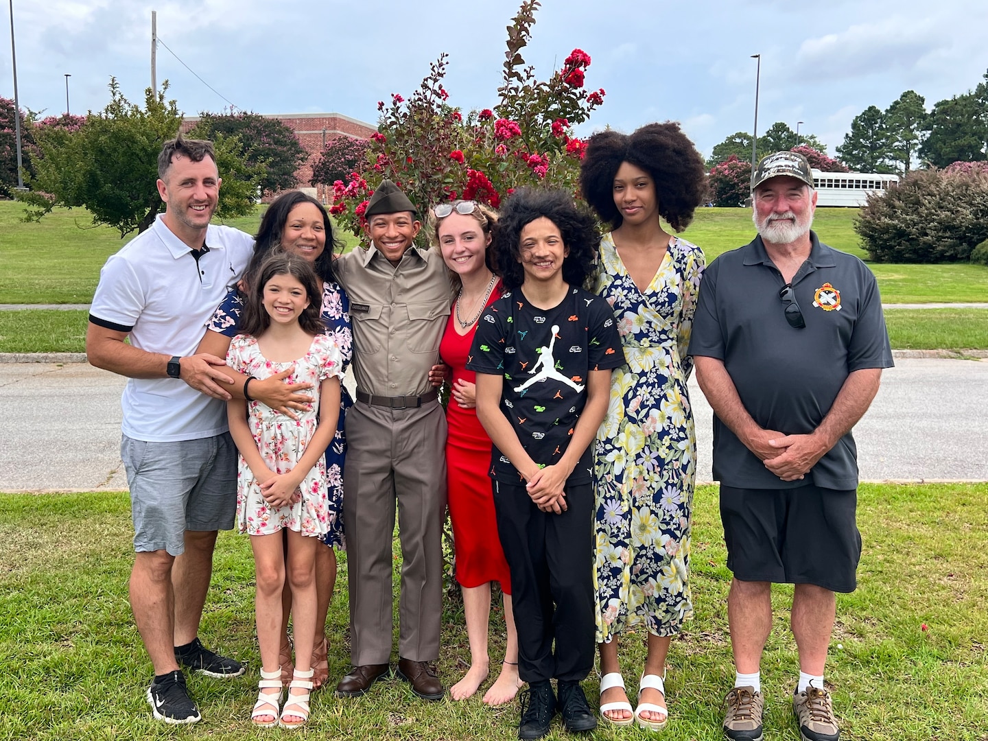 U.S. Army 1st Lt. Andrew Devine, far left, stands for a photograph with his son, then U.S. Army Pvt. Isaiah Castellanos, following Castellanos' completion of Basic Combat Training at Fort Jackson, S.C., on Aug. 10, 2023. 1st Lt. Devine served on active duty from 2004 to 2010, and joined the D.C. National Guard in 2020. His son joined in 2023.