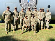 U.S. Army 1st Lt. Andrew Devine, second from left, and his son, Pfc. Isaiah Castellanos, fourth from left, stand for a photograph with members of the District of Columbia National Guard following the completion of Air Assault School at Fort Moore, Ga., on Sept. 20, 2024. Upon completion of Air Assault School each soldier is able to perform skills required to make maximum use of helicopter assets in training and in combat to support mission objectives.