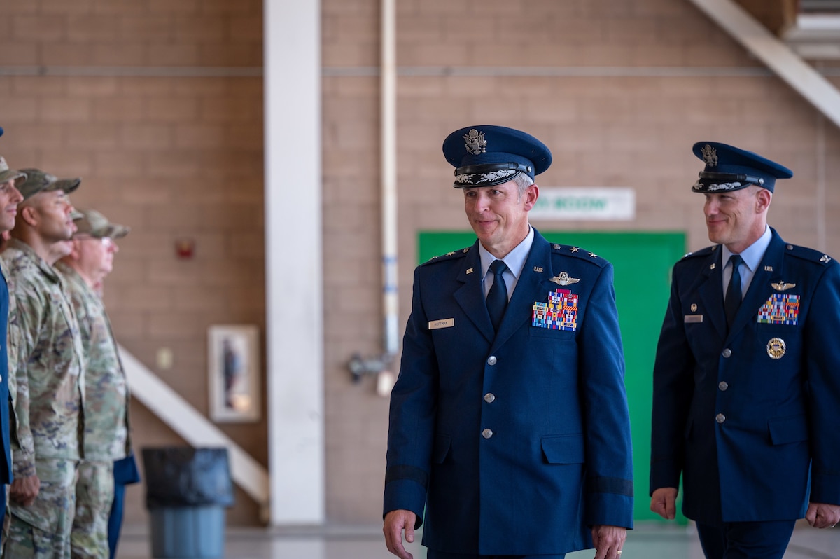Men in military dress uniforms walk