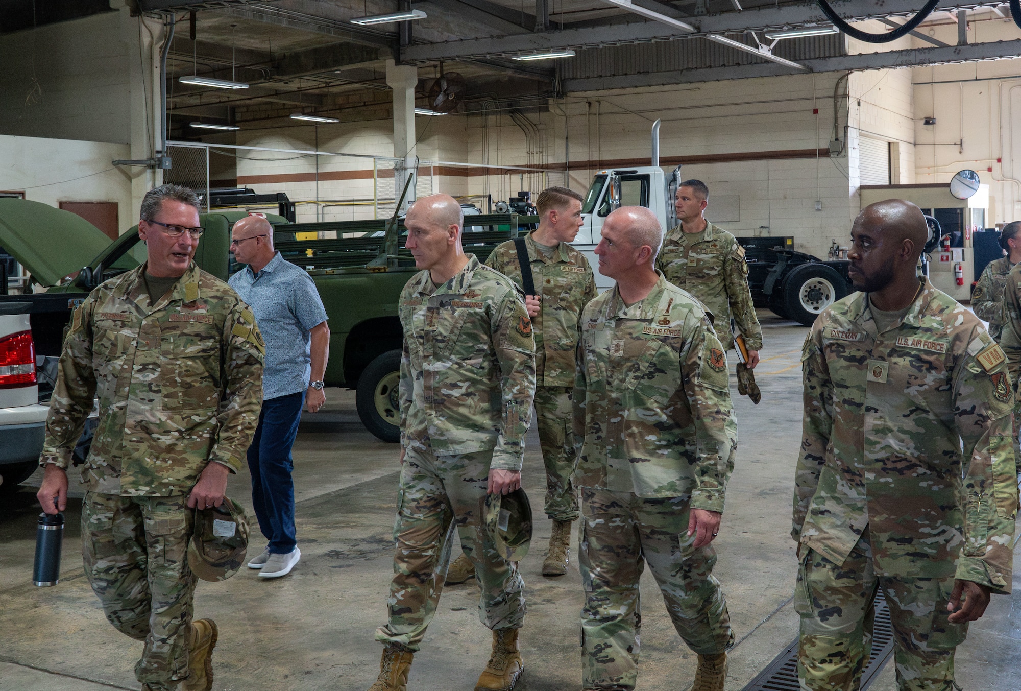 (Front Row) From left, Brig. Gen. Thomas Palenske, 36th Wing commander, Gen. David Allvin, Chief of Staff of the Air Force, Chief Master Sgt. David Flosi, Chief Master Sergeant of the Air Force, and MSgt. Keith Coleman, 36th Logistics Readiness Squadron vehicle fleet manager, tour the Vehicle maintenance warehouse at Andersen Air Force Base, Guam, Oct. 13, 2024. As part of a week-long trip to the region, Allvin and Flosi visited Andersen to receive updates on how the team is strengthening partnership while also expanding combat capability. (U.S. Air Force photo by Airman 1st Class Manasseh Demissie)