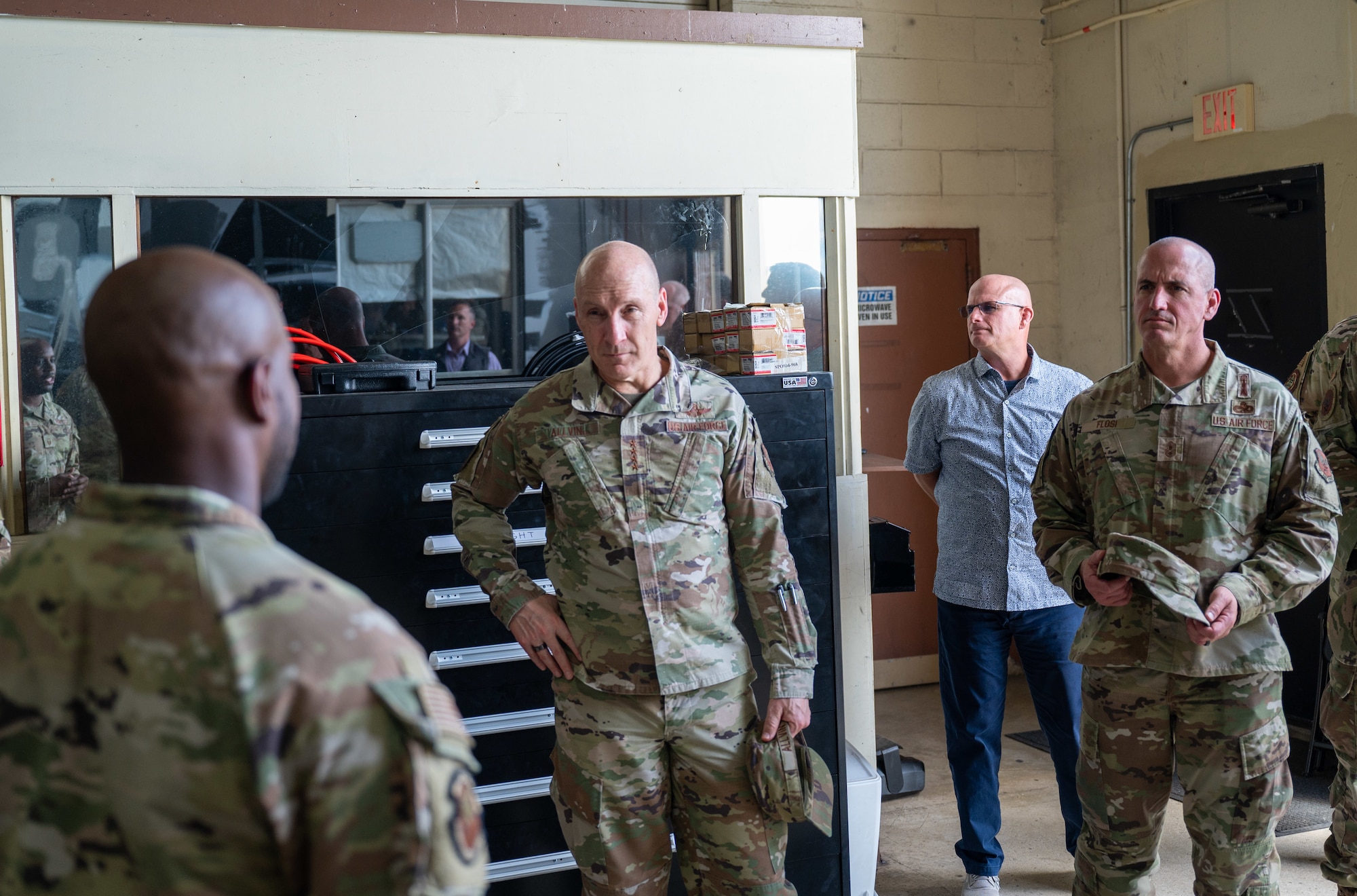 Gen. David Allvin, Chief of Staff of the Air Force, center, and Chief Master Sgt. David Flosi, Chief Master Sergeant of the Air Force, right, receive a brief from MSgt. Keith Coleman, 36th Logistics Readiness Squadron vehicle fleet manager, at Andersen Air Force Base, Guam, Oct. 13,2024. As part of a week-long trip to the region, Allvin and Flosi visited Andersen to receive updates on how the team is strengthening partnership while also expanding combat capability. (U.S. Air Force photo by Airman 1st Class Manasseh Demissie)