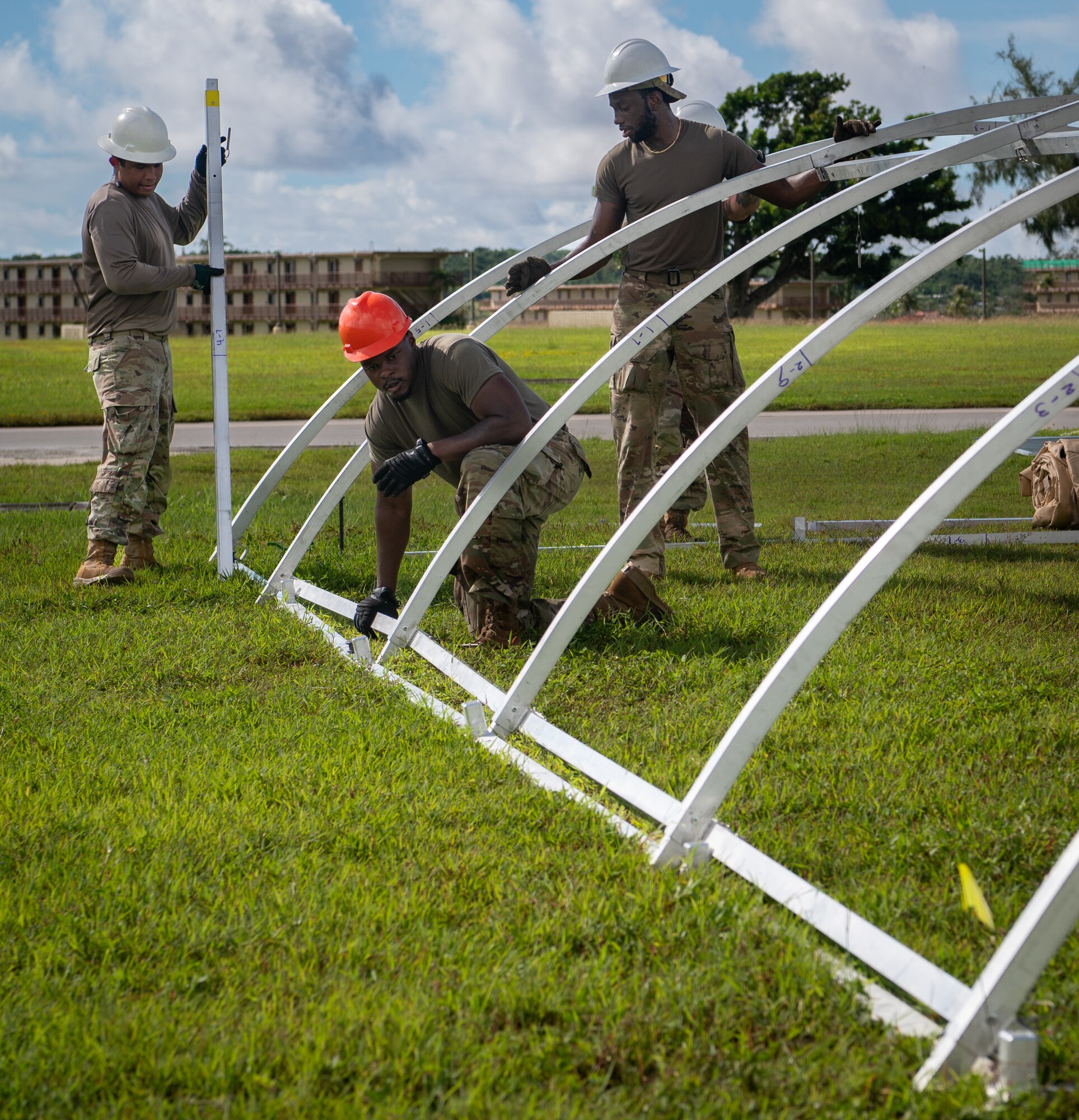 36th Civil Engineer Squadron Airmen prepare tent structures for the Operation Readiness Exercise, Slingstone 24-4, at Andersen Air Force Base, Guam, Oct. 15, 2024. This exercise is to showcase Andersen AFB capabilities to deter opportunistic acts of aggression through forward presence and the ability to rapidly respond to crises. (U.S. Air Force photo by Staff Sgt. Pedro Tenorio)