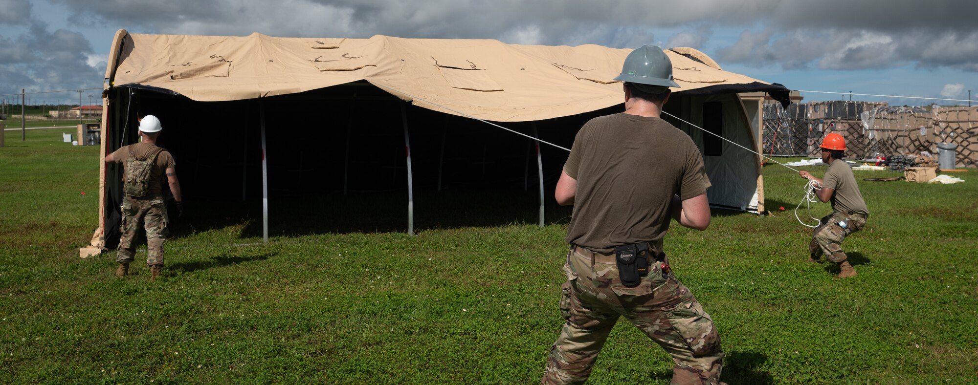 36th Civil Engineer Squadron Airmen prepare tent structures for the Operation Readiness Exercise, Slingstone 24-4, at Andersen Air Force Base, Guam, Oct. 15, 2024. This exercise is to showcase Andersen AFB capabilities to deter opportunistic acts of aggression through forward presence and the ability to rapidly respond to crises. (U.S. Air Force photo by Staff Sgt. Pedro Tenorio)