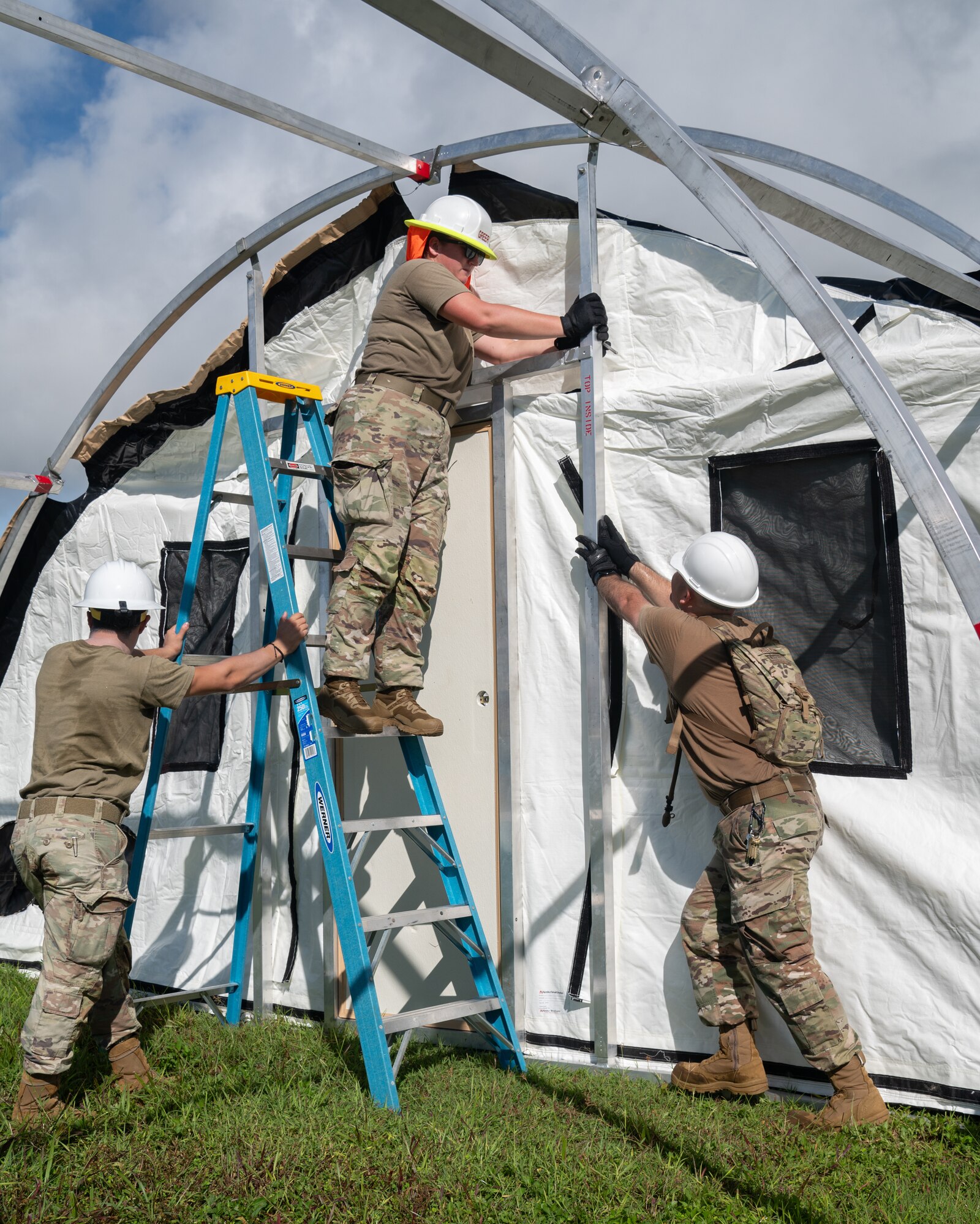 36th Civil Engineer Squadron Airmen prepare tent structures for the Operation Readiness Exercise, Slingstone 24-4, at Andersen Air Force Base, Guam, Oct. 15, 2024. This exercise is to showcase Andersen AFB capabilities to deter opportunistic acts of aggression through forward presence and the ability to rapidly respond to crises. (U.S. Air Force photo by Staff Sgt. Pedro Tenorio)