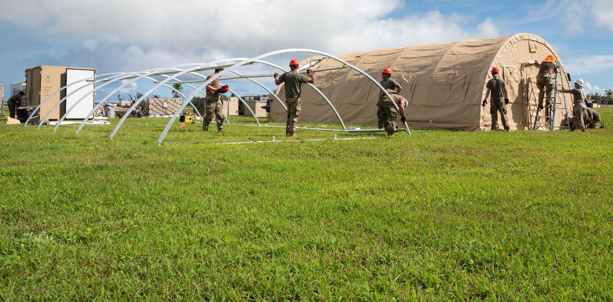 36th Civil Engineer Squadron Airmen prepare tent structures for the Operation Readiness Exercise, Slingstone 24-4, at Andersen Air Force Base, Guam, Oct. 15, 2024. This exercise is to showcase Andersen AFB capabilities to deter opportunistic acts of aggression through forward presence and the ability to rapidly respond to crises. (U.S. Air Force photo by Staff Sgt. Pedro Tenorio)