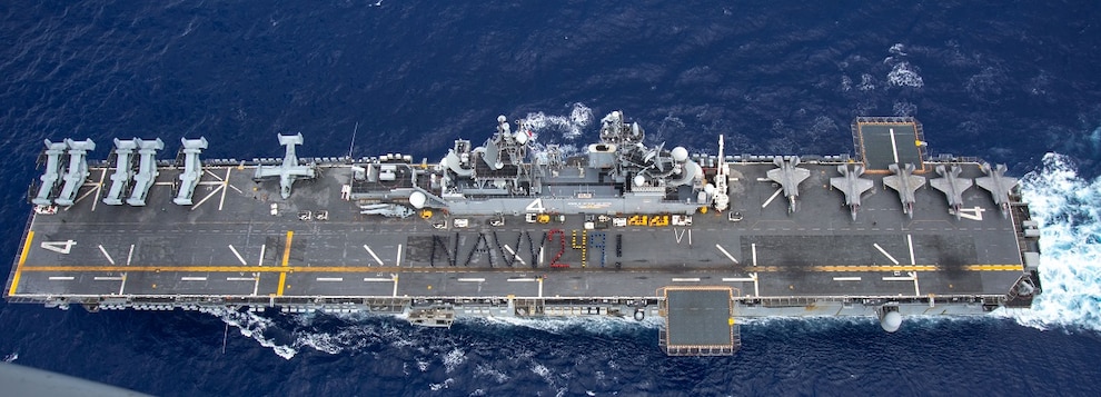 Sailors assigned to the Wasp-class amphibious assault ship USS Boxer (LHD 4) stand in formation spelling “NAVY 249!” for the 249th Navy birthday on the flight deck as the ship steams in the Philippine Sea, Oct. 13, 2024.