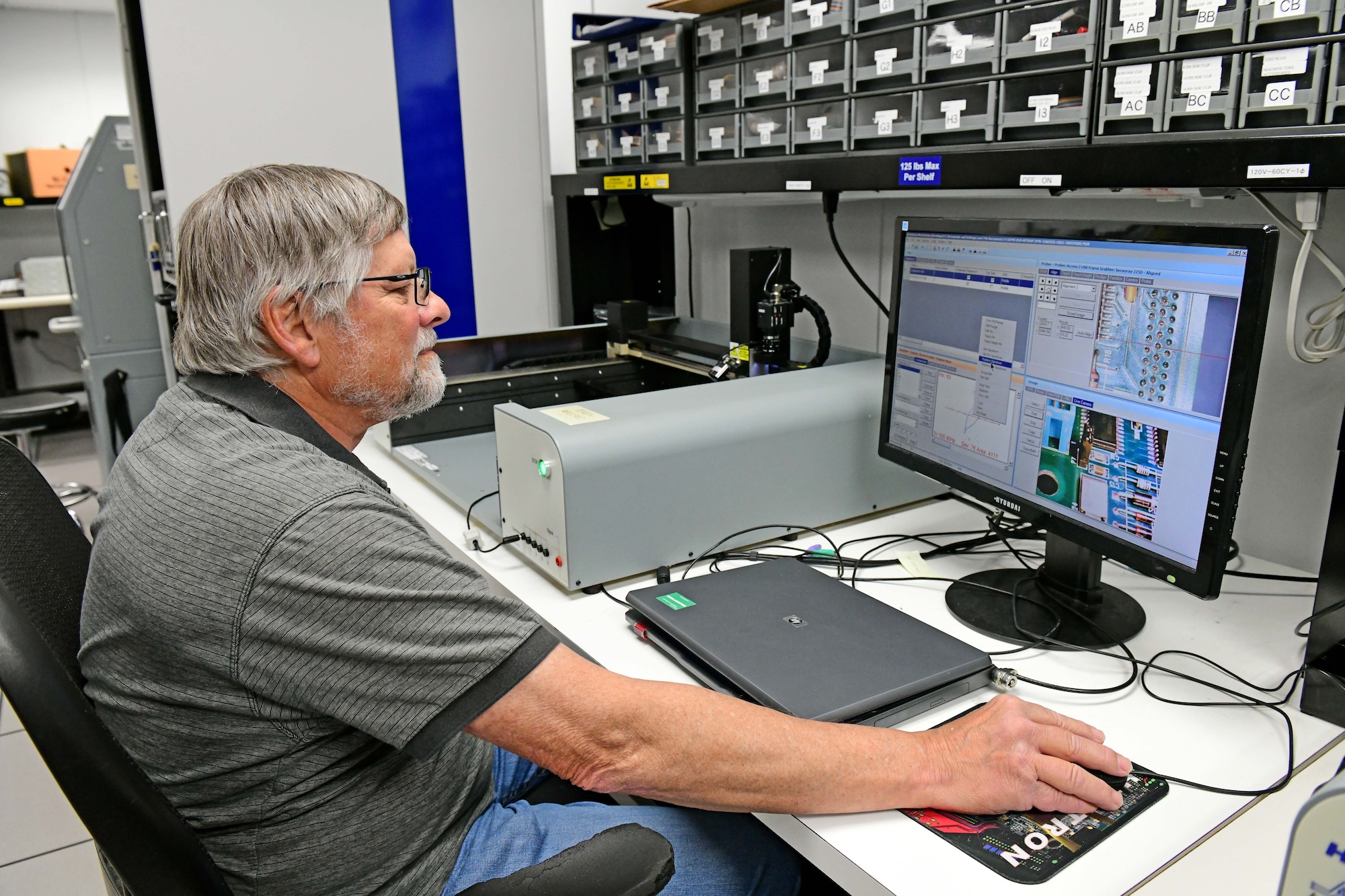 Man sitting down while using computer