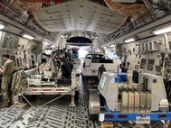 Airfield Pavement Evaluation team equipment is loaded on a C-17