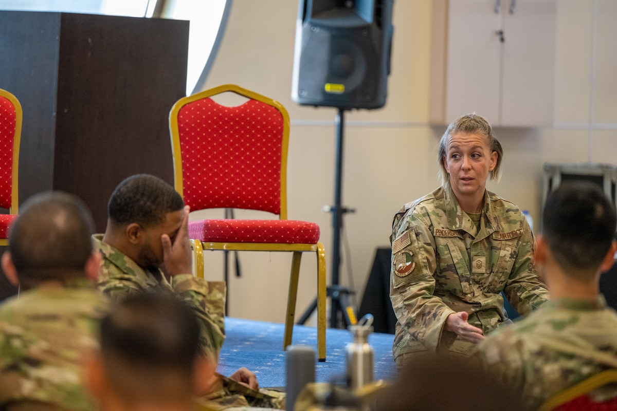 A photo of Airmen speaking to eachother.