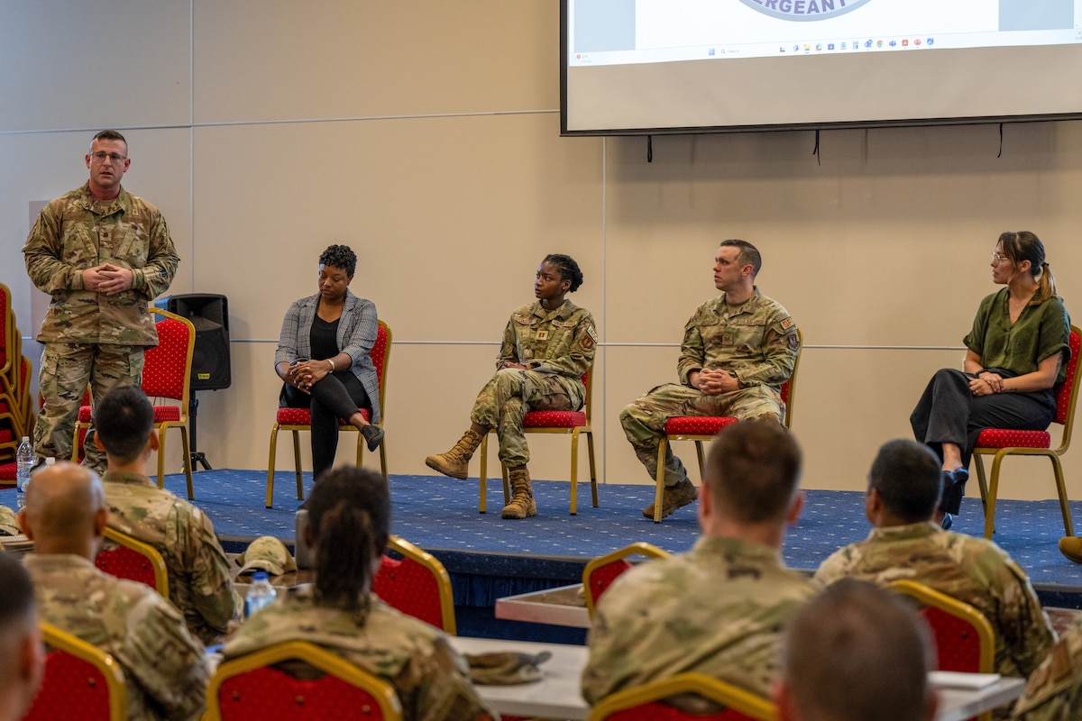 A photo of Airmen speaking.