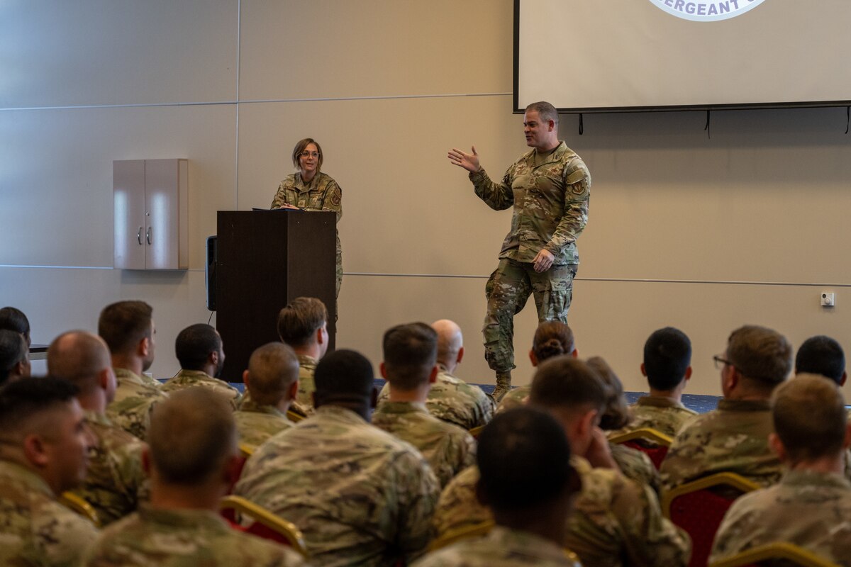 A photo of an Airman addressing other Airmen.