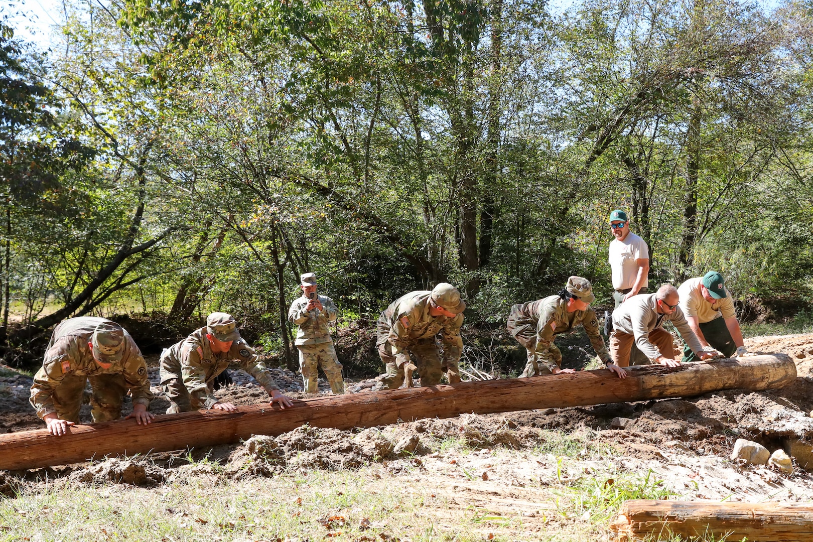 North Carolina National Guardsmen with the 113th Sustainment Brigade and the 30th Armored Brigade Combat Team conduct bridge-building operations in Nebo, N.C., Oct. 9, 2024. In support of Joint Task Force-North Carolina, Guardsmen built bridges to connect roadways for residents following Tropical Storm Helene.