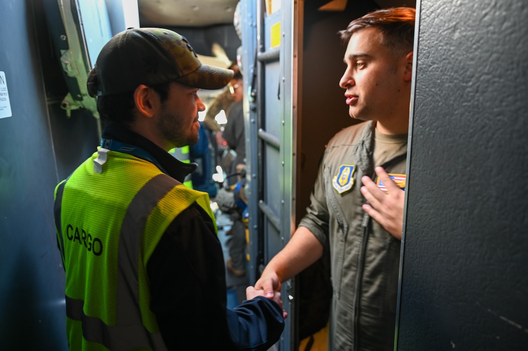 Tomas Pieter, Ostrava Airport cargo handling manager, shakes hands with 1st Lt. Marc D’Amore, 68th AS C-5 pilot, during a tour of the C-5M Super Galaxy at Leoš Janáček Airport, Czech Republic, Sept. 21, 2024.