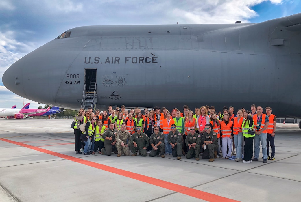 Czech Republic high school students from Masarykovo gymnázium Příbor, pose for a group photowith 433rd Airlift Wing Rerserve Citizen Airmen after a tour of the C-5M Super Galaxy at Leoš Janáček Airport in Ostrava, Czech Republic, Sept. 24, 2024.