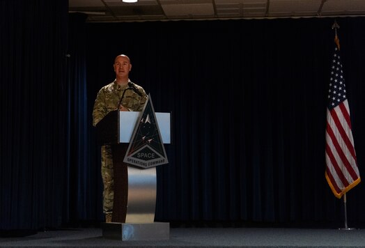  U.S. Space Force Colonel Andrew Menschner, Mission Delta 31 commander, addresses an audience during a redesignation ceremony at Peterson Space Force Base, Colo., Oct. 15, 2024. During the ceremony the Position, Navigation and Timing (PNT) Provisional Delta was officially redesignated as Mission Delta 31. The Delta continues to provide, operate and sustain high-integrity PNT capabilities to protect our nation’s interests and assure an unparalleled global utility of the Global Positioning Satellite constellation, but with additional units dedicated to future capability development. (U.S. Space Force photo by John Ayre)