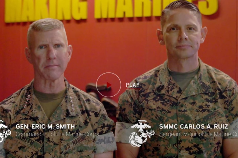 Two Marines face the camera for a message.