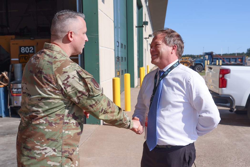 U.S. Air Force Chief Master Sgt. Bruce Hedrick, 127th Wing command chief master sergeant, left, meets Duane DuRay, director of Marquette Sawyer Regional Airport, in Gwinn, Michigan, Oct. 1, 2024. Nearly 100 Airmen from the 127th Air Refueling and 127th Mission Support Groups, temporarily dispersed to Marquette Sawyer Regional Airport in Gwinn and Detroit Metropolitan Wayne County Airport in Romulus while the runway was repaired at Selfridge Air National Guard Base. (U.S. Air National Guard photo by Tech. Sgt. Andrew Schumann)