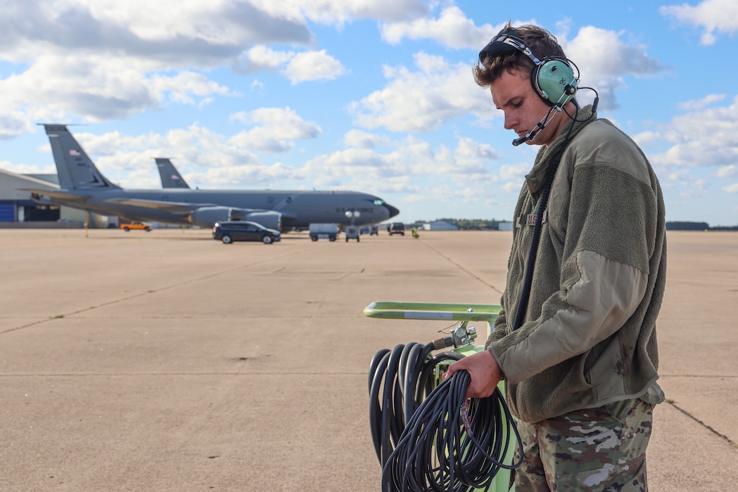 U.S. Air Force Senior Airman Stephen Akers, a crew chief with the 191st Aircraft Maintenance Squadron, Michigan Air National Guard, opens a grounding cord in Gwinn, Michigan, Oct. 1, 2024. Nearly 100 Airmen from the 127th Air Refueling and 127th Mission Support Groups, temporarily dispersed to Marquette Sawyer Regional Airport in Gwinn and Detroit Metropolitan Wayne County Airport in Romulus while the runway was repaired at Selfridge Air National Guard Base. (U.S. Air National Guard photo by Tech. Sgt. Andrew Schumann)