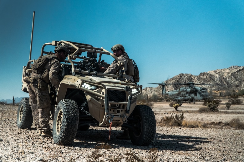 U.S. Marine Corps Cpl. Jacob Hardin, left, an Evansville, Indiana native and a low altitude air defense gunner assigned to 3rd Low Altitude Air Defense Battalion, 3rd Marine Aircraft Wing and Staff Sgt. Raymond Cardenas, a Los Angeles, California native and a low altitude air defense gunner assigned to Marine Aviation Weapons and Tactics Squadron One, participate in a ground-based air defense exercise as part of Weapons and Tactics Instructor course 1-25 at Tacts Airfield, near Wellton, Arizona, Oct. 10, 2024. WTI is a seven-week training event hosted by MAWTS-1 which emphasizes operational integration of the six functions of Marine aviation in support of the Marine Air Ground Task Force, Joint and Coalition Forces. (U.S. Marine Corps photo by Cpl. Maurion Moore)