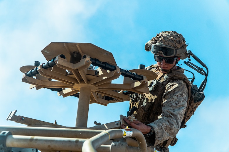 U.S. Marine Corps Lance Cpl. Brayden Westcott a Midland, Texas native and a low altitude air defense gunner assigned 3rd Low Altitude Air Defense Battalion, 3rd Marine Aircraft Wing, sets up a radar pedestal on a Light Marine Air-Defense Integrated System during a ground-based air defense exercise as part of Weapons and Tactics Instructor course 1-25 at Tacts Airfield, near Wellton, Arizona, Oct. 10, 2024. WTI is a seven-week training event hosted by Marine Aviation Weapons and Tactics Squadron One which emphasizes operational integration of the six functions of Marine aviation in support of the Marine Air Ground Task Force, Joint and Coalition Forces. (U.S. Marine Corps photo by Cpl. Maurion Moore)