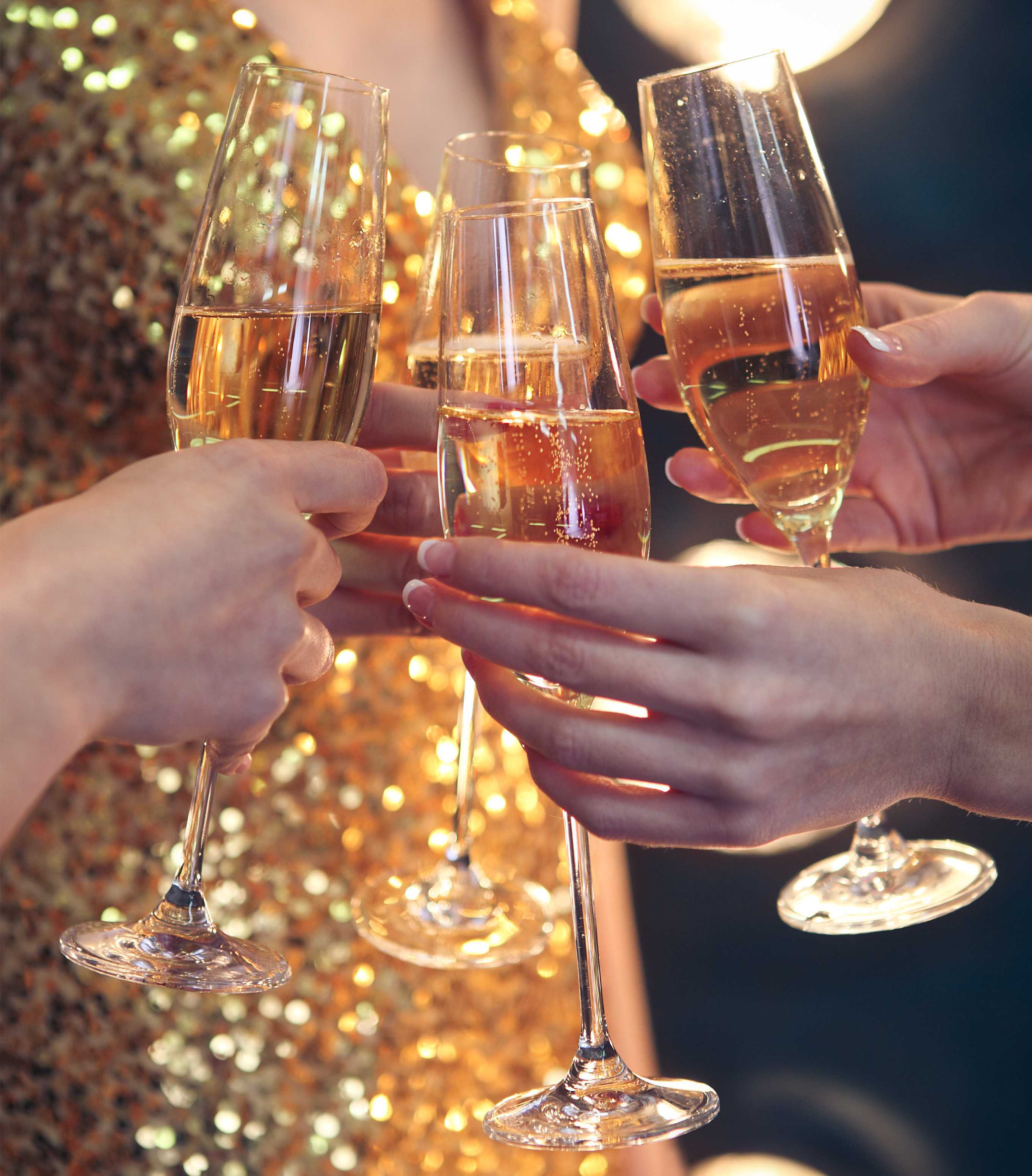 People Holding Glasses Of Champagne Making A Toast