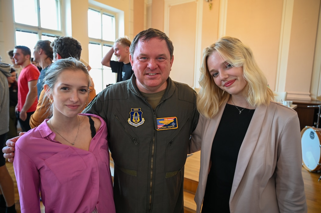 Lt. Col. Jeremy Hooper, 68th Airlift Squadron evaluator C-5 pilot, poses with students from Masarykovo gymnázium Příbor, a high School in the Czech Republic, after a seminar about serving in the United States Air Force, Sept. 24, 2024.