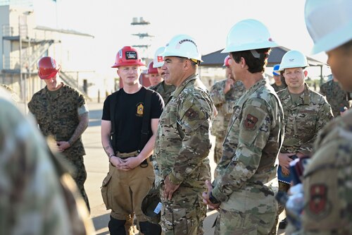 U.S. Air Force Maj. Gen. Wolfe Davidson, Second Air Force Commander, receives a briefing on the different blocks of training at the Louis F. Garland Department of Defense Fire Academy, Goodfellow Air Force Base, Texas, Oct. 1, 2024. While at the Fire Academy, Davidson got a close-up look at the equipment used for training different obstacles they face and met with students. (U.S. Air Force photo by Airman 1st Class Madi Collier)