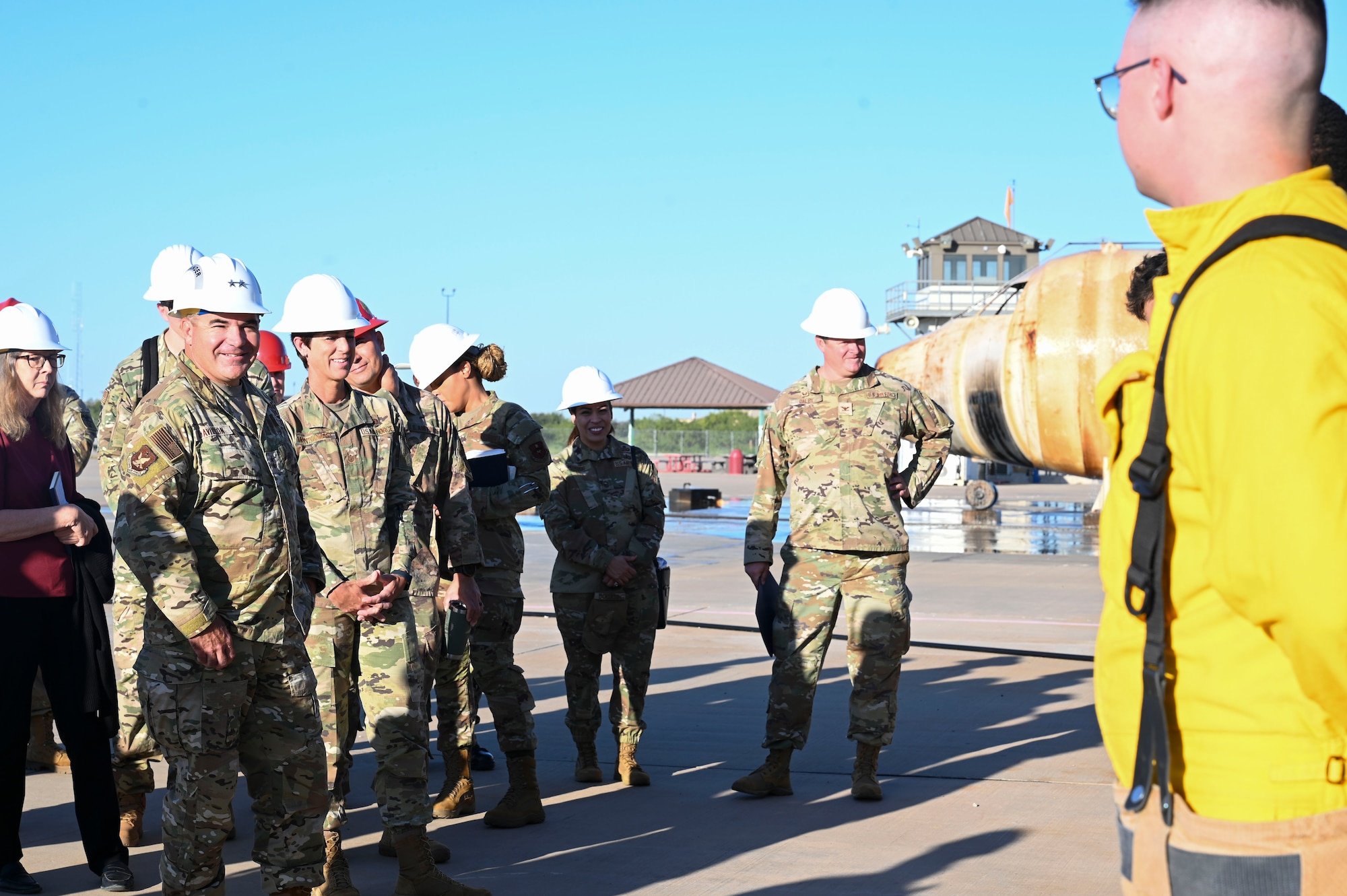 U.S. Air Force Maj. Gen. Wolfe Davidson, Second Air Force Commander, and Chief Master Sgt. Kristina Montgomery, Second Air Force Command Chief, discusses with students their experience at the 312th Training Squadron, Louis F. Garland Department of Defense Fire Academy, Goodfellow Air Force Base, Texas, Oct. 1, 2024. The 312th TRS mission is to train, develop, and inspire warriors to deliver fire emergency services and nuclear treaty monitoring for the Department of Defense and our international partners. (U.S. Air Force photo by Airman 1st Class Madi Collier)