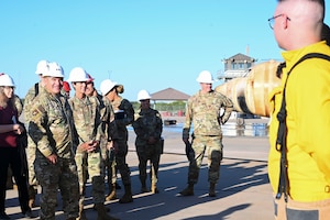 U.S. Air Force Maj. Gen. Wolfe Davidson, Second Air Force Commander, and Chief Master Sgt. Kristina Montgomery, Second Air Force Command Chief, discusses with students their experience at the 312th Training Squadron, Louis F. Garland Department of Defense Fire Academy, Goodfellow Air Force Base, Texas, Oct. 1, 2024. The 312th TRS mission is to train, develop, and inspire warriors to deliver fire emergency services and nuclear treaty monitoring for the Department of Defense and our international partners. (U.S. Air Force photo by Airman 1st Class Madi Collier)