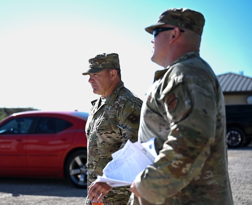 U.S. Air Force Maj. Gen. Wolfe Davidson, Second Air Force Commander, walks with Lt. Col. Garrett Williams, 313th Training Squadron Commander, at the Joint All-Domain Expeditionary Forward Operations Readiness Generation Exercise site, Goodfellow Air Force Base, Texas, Oct. 1, 2024. JADE FORGE immerses joint service intelligence professionals in a simulated operational environment, enabling them to apply essential intelligence functions—analysis, collection, integration, and targeting—in a realistic setting. (U.S. Air Force photo by Airman 1st Class Madi Collier)