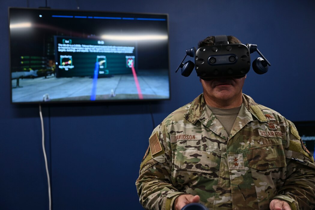 U.S. Air Force Maj. Gen. Wolfe Davidson, Second Air Force Commander, uses virtual reality training equipment at the 17th Training Support Squadron’s Instructional Technology Unit, Goodfellow Air Force Base, Texas, Oct. 1, 2024. These programs aim to keep Airmen informed and mission-ready as they transition to their operational units. (U.S. Air Force photo by Airman 1st Class Madi Collier)