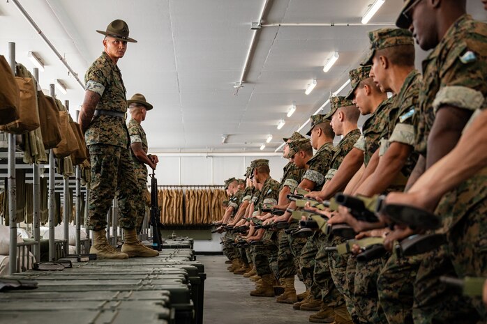 U.S. Marine Corps Sgt. Sean O’Keefe, front left, and Sgt Kimaaron Gumiran, back left, both drill instructors with Mike Company, 3rd Recruit Training Battalion, observe recruits during close order drill practice at Marine Corps Recruit Depot San Diego, California, Sept. 17, 2024. Drill is essential to recruit training as it instills confidence, teamwork and discipline within recruits. (U.S. Marine Corps photo by Lance Cpl. Eric Valerio)