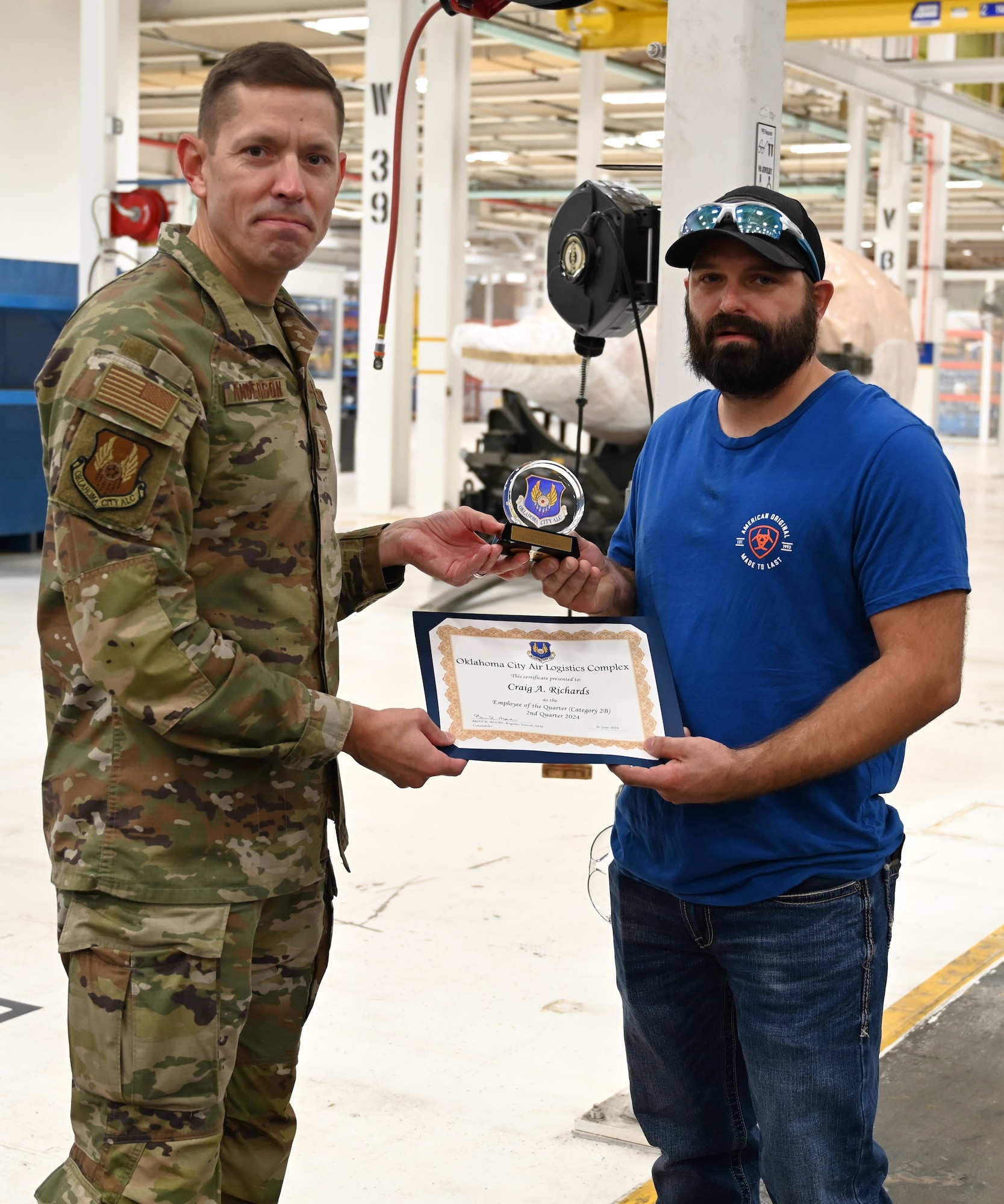 Two men holding a certificate