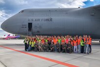 Czech Republic high school students from Masarykovo gymnázium Příbor, pose for a group photowith 433rd Airlift Wing Rerserve Citizen Airmen after a tour of the C-5M Super Galaxy at Leoš Janáček Airport in Ostrava, Czech Republic, Sept. 24, 2024.