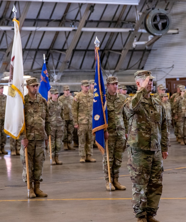 Lt. Col. Zachary DeGroot, of Chatham, 1st Battalion, 106th Aviation Regiment’s new commander, salutes at the end of the battalion’s change of command ceremony Oct. 5 in Peoria.