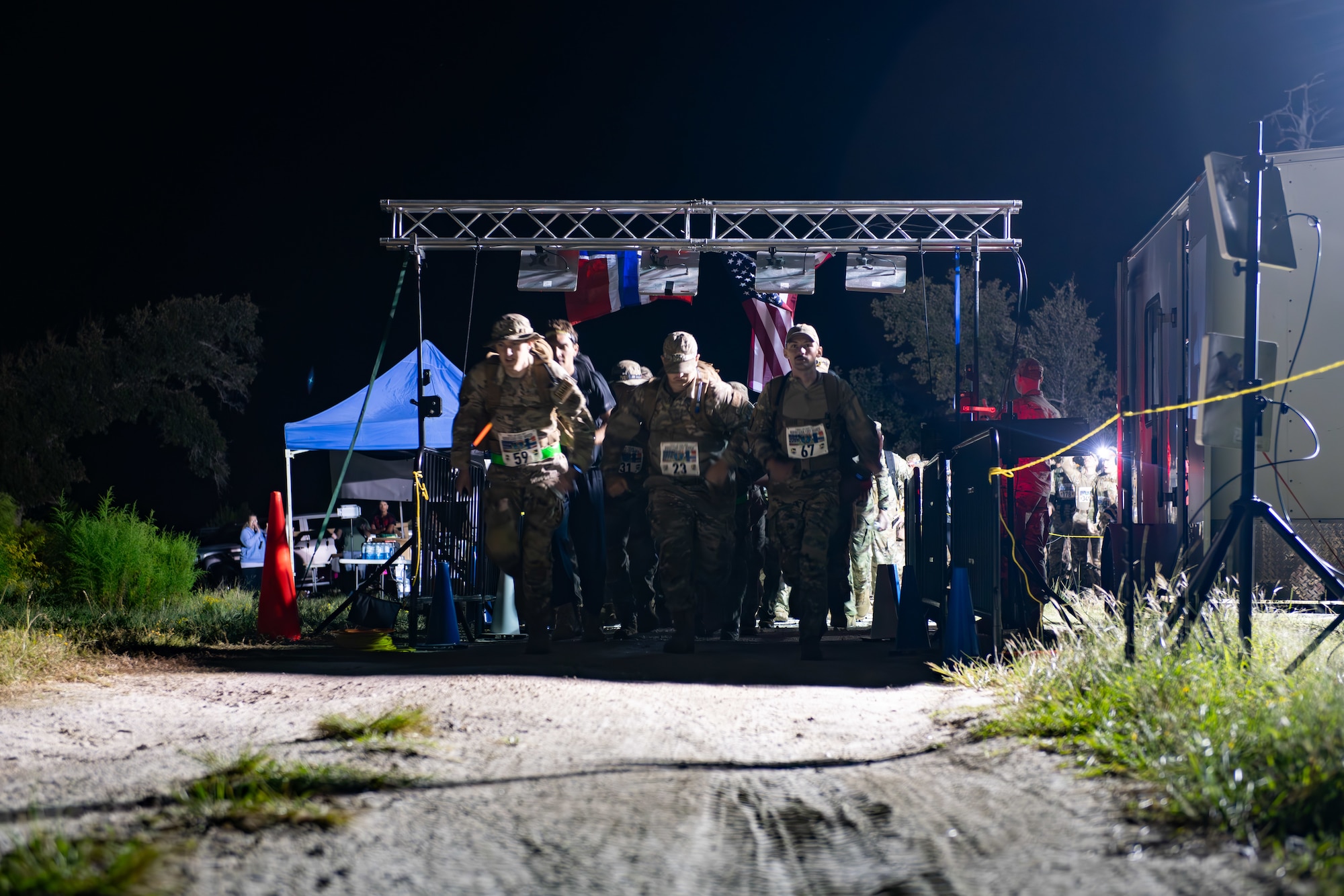 U.S. Airmen and Soldiers participate in a ruck march.
